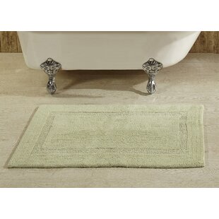 cambridge round tufted bath mat with tassels